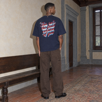 Man wearing the SERENOS Final Version T-Shirt in navy blue, back print reading This isn't the final version of you