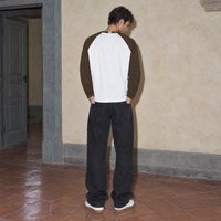 Man seen from behind wearing the Look raglan long sleeve by Serenos, showing the plain white back and coffee brown raglan sleeves