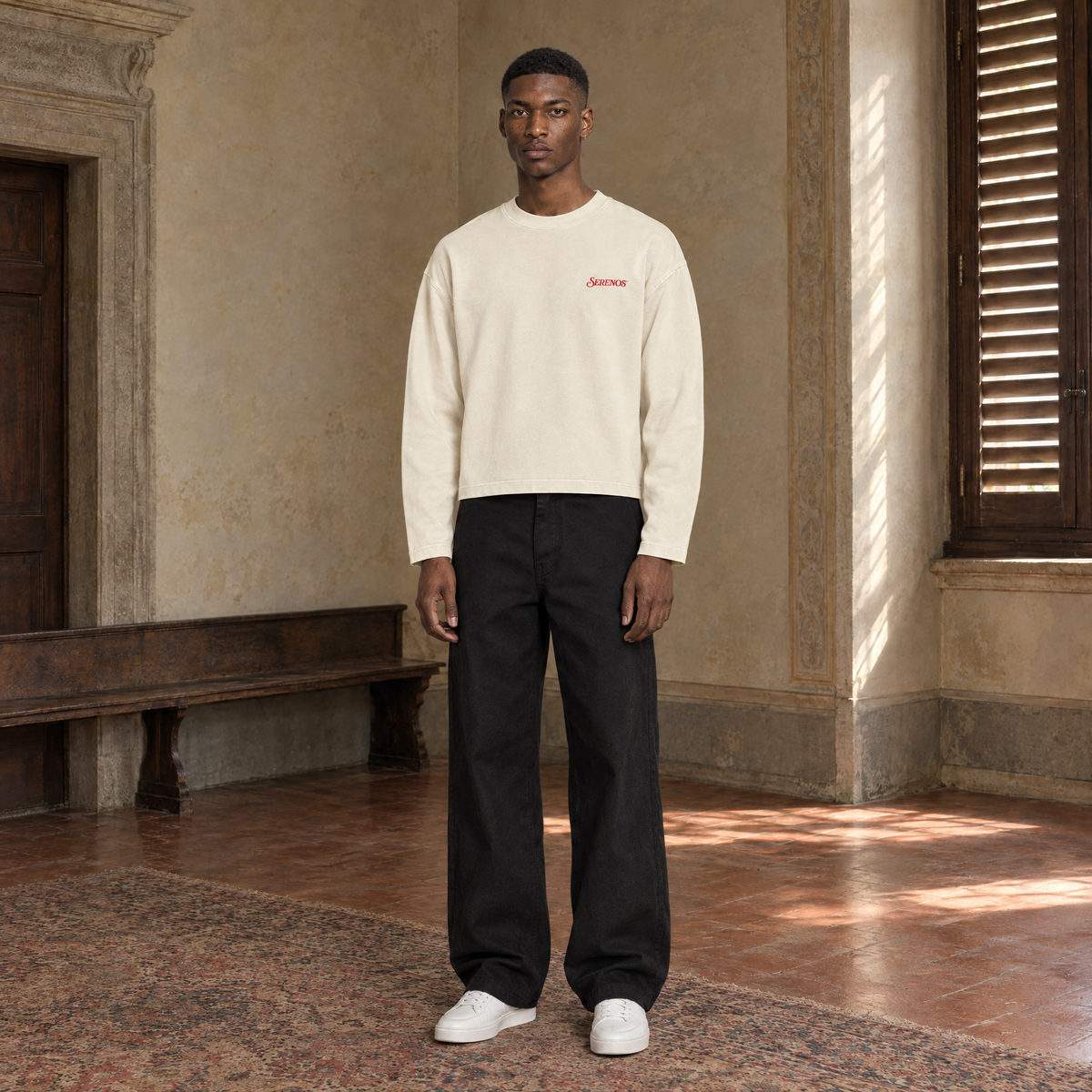 Man wearing the SERENOS Love long sleeve in apricot, front view with the small red chest logo