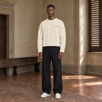 Man wearing the SERENOS Love long sleeve in apricot, front view with the small red chest logo