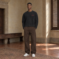 Man wearing the SERENOS Love long sleeve in black, front view with the small red chest logo