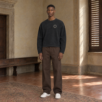 Man wearing the SERENOS Shy long sleeve in black, front view with the small ring logo on the chest