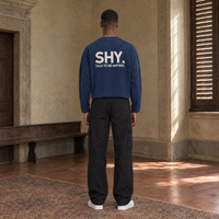 Man seen from behind wearing the SERENOS Shy long sleeve in navy blue, back print reading Shy, talk to me anyway