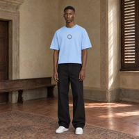 Man wearing the SERENOS Shy T-Shirt in blue, front view with the small ring logo at the centre of the chest