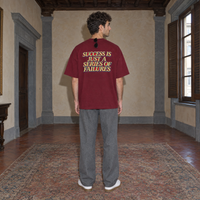 Man wearing the SERENOS Success T-Shirt in wine red, back print reading Success is just a series of failures